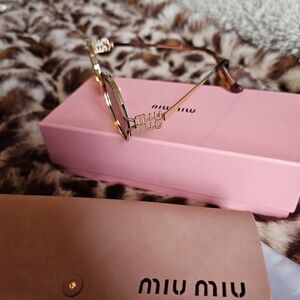 Miu Miu Gold Metal Logo Sunglasses with Tortoiseshell Temples and Pink Case